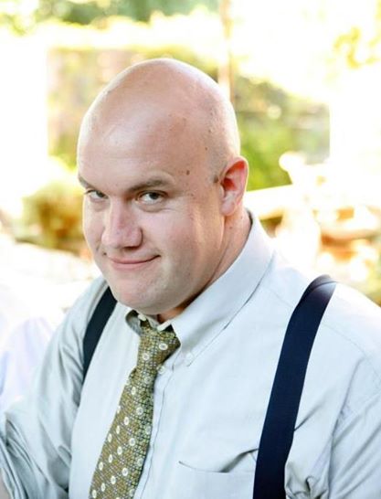 Guy Branum, when he's not posing for publicity stills dressed like a gay detective on some awful CBS police procedural your Granma watches, will also pop into Seattle on Friday, June 20th for the "Out & In" FREE queer comedy showcase at The Neptune with a buttload of local queer comedians including our interviewer, Nick Sahoyah.