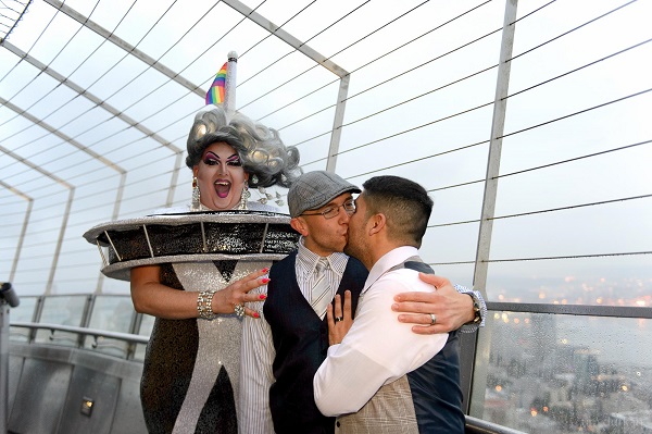 On Saturday, June 14, Seattle's own Mama Tits married Dustin Stersic and Andrew Malone on top of the Space Needle...while she was dressed AS the Space Needle. Photo by Tim Durkan.