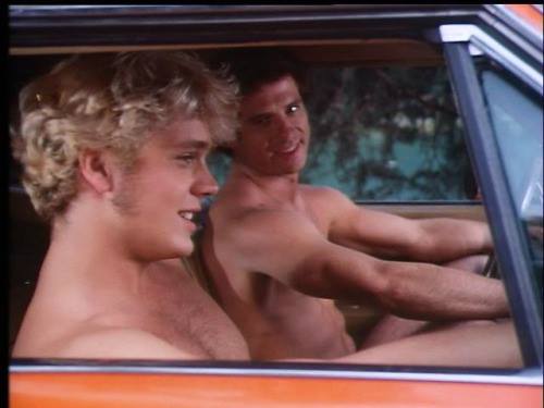 Two young actors, naked in a car....probably singing selections from Sondheim's "Company". 